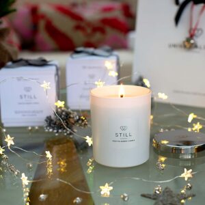 POSITIVE ENERGY CANDLE STILL - 30CL against a Christmas back drop - The Universal Soul Company